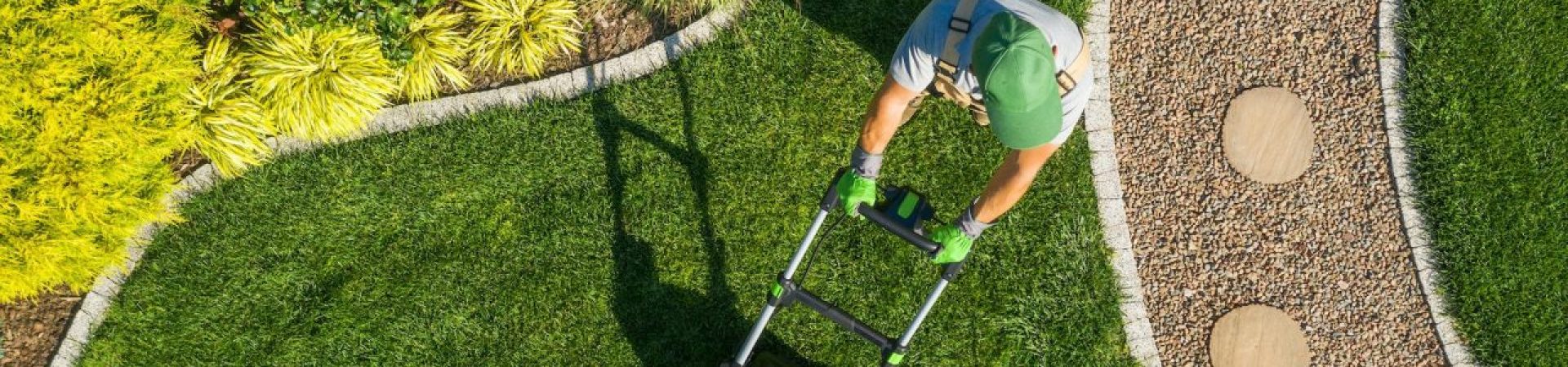 gardener-mowing-backyard-garden-grass-aerial-view-.jpg